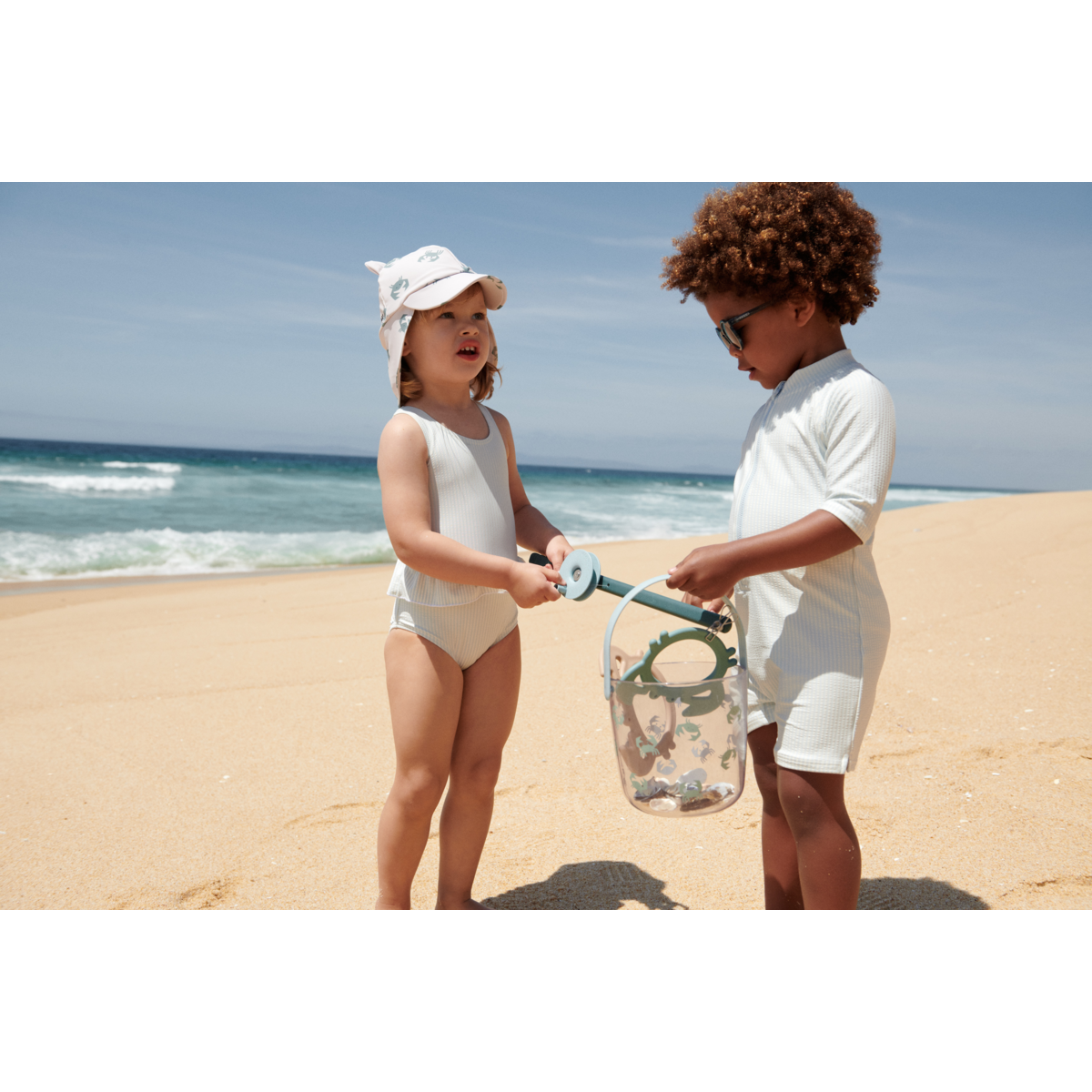 Liewood Max Seersucker Short-sleeve swim Jumpsuit - Y/D stripe Pure sky / Creme de la creme - SWIMSUIT